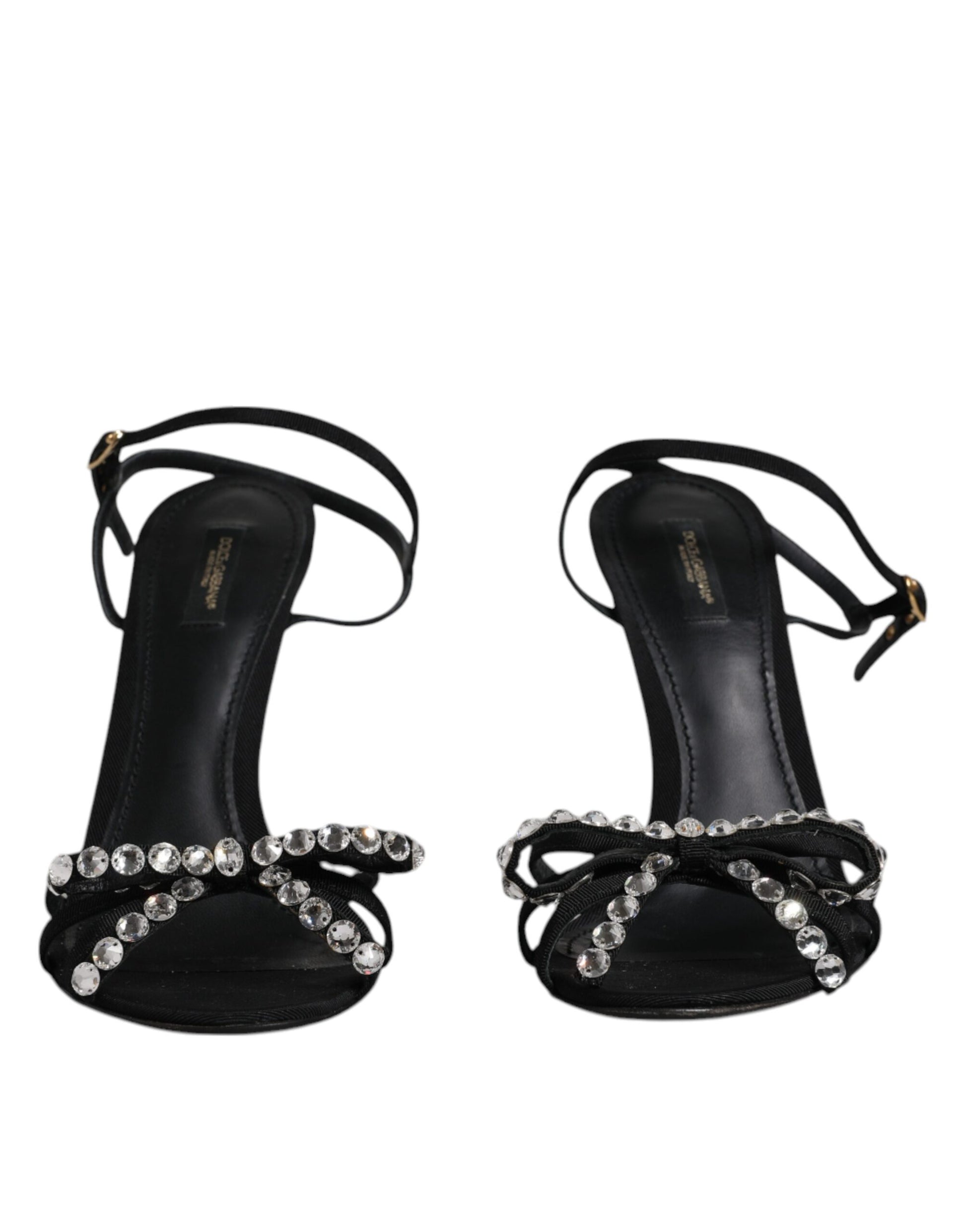 Pair of black high heel shoes with rhinestones on straps