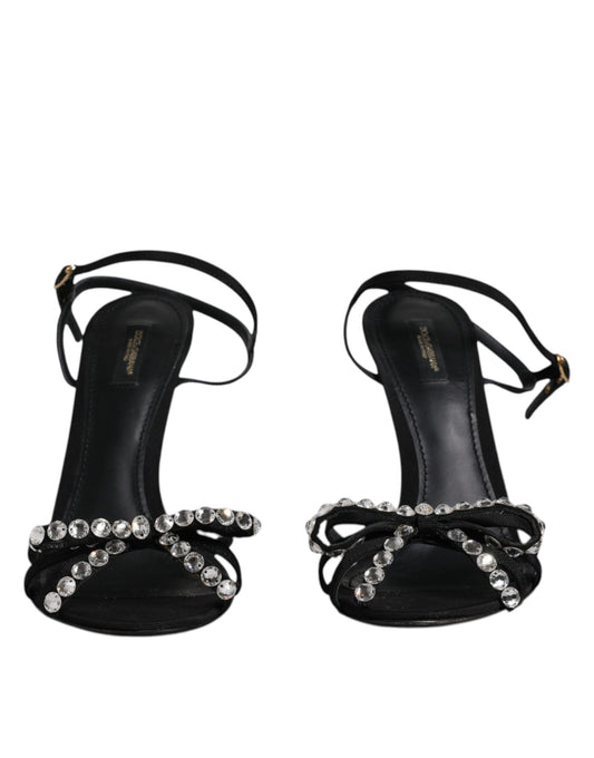 Pair of black high heel shoes with rhinestones on straps