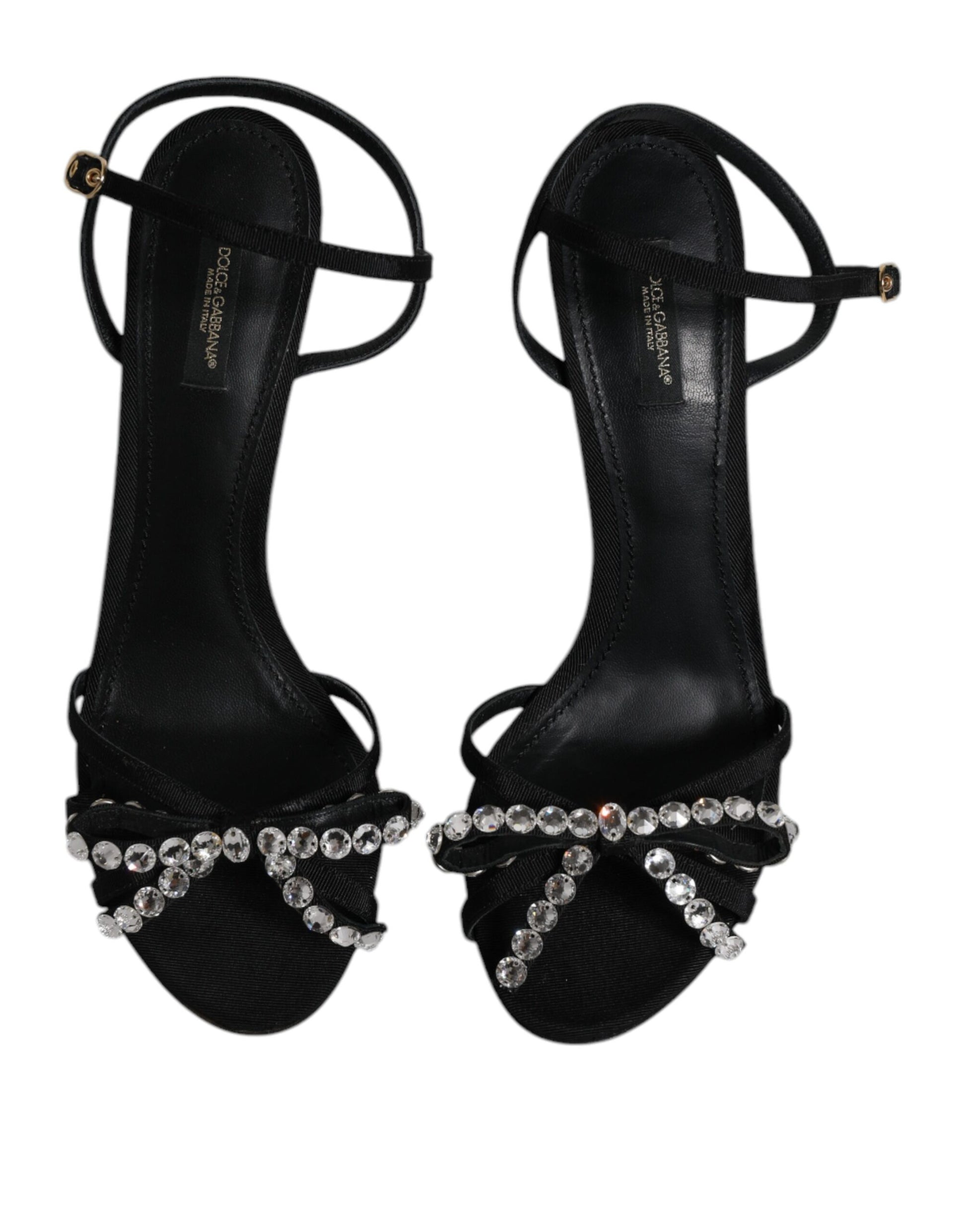 Pair of black high heel shoes with rhinestones on straps