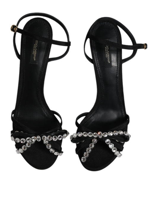 Pair of black high heel shoes with rhinestones on straps