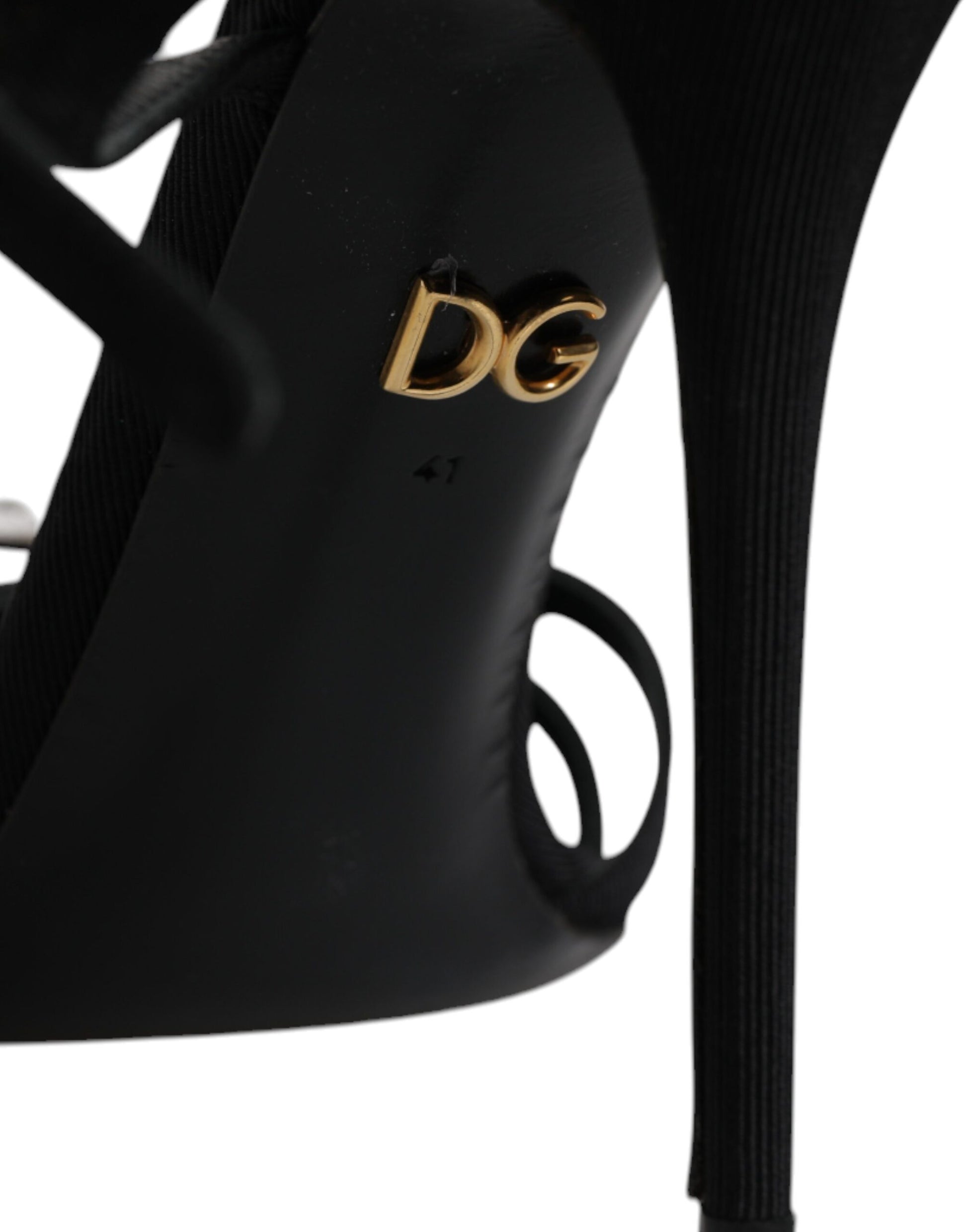High heel shoe with gold logo on back
