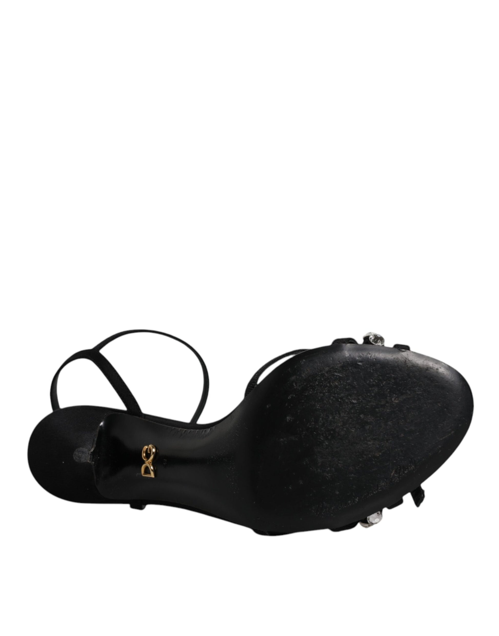 Black shoe with gold buckle