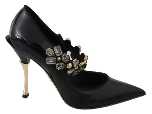 Black high heel shoe with gold accents and rhinestones on toe