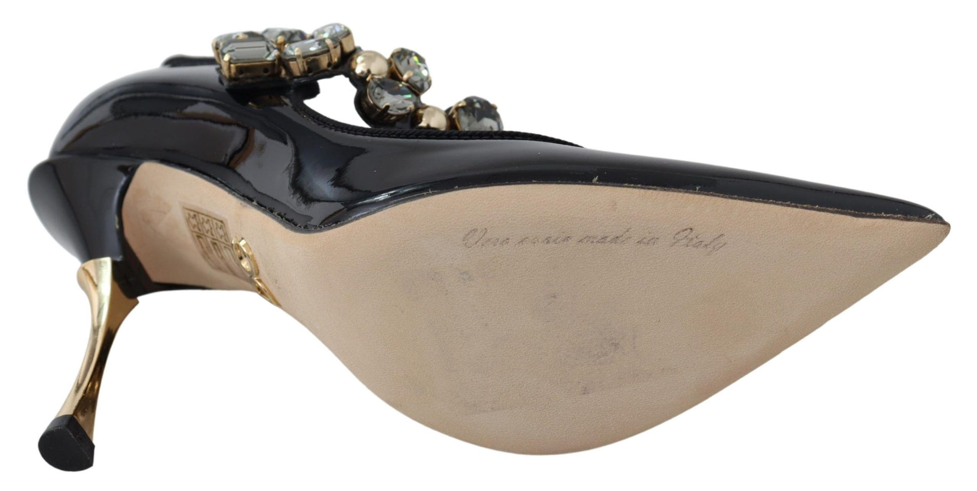 Black high heel shoe with beaded straps and a bow on top