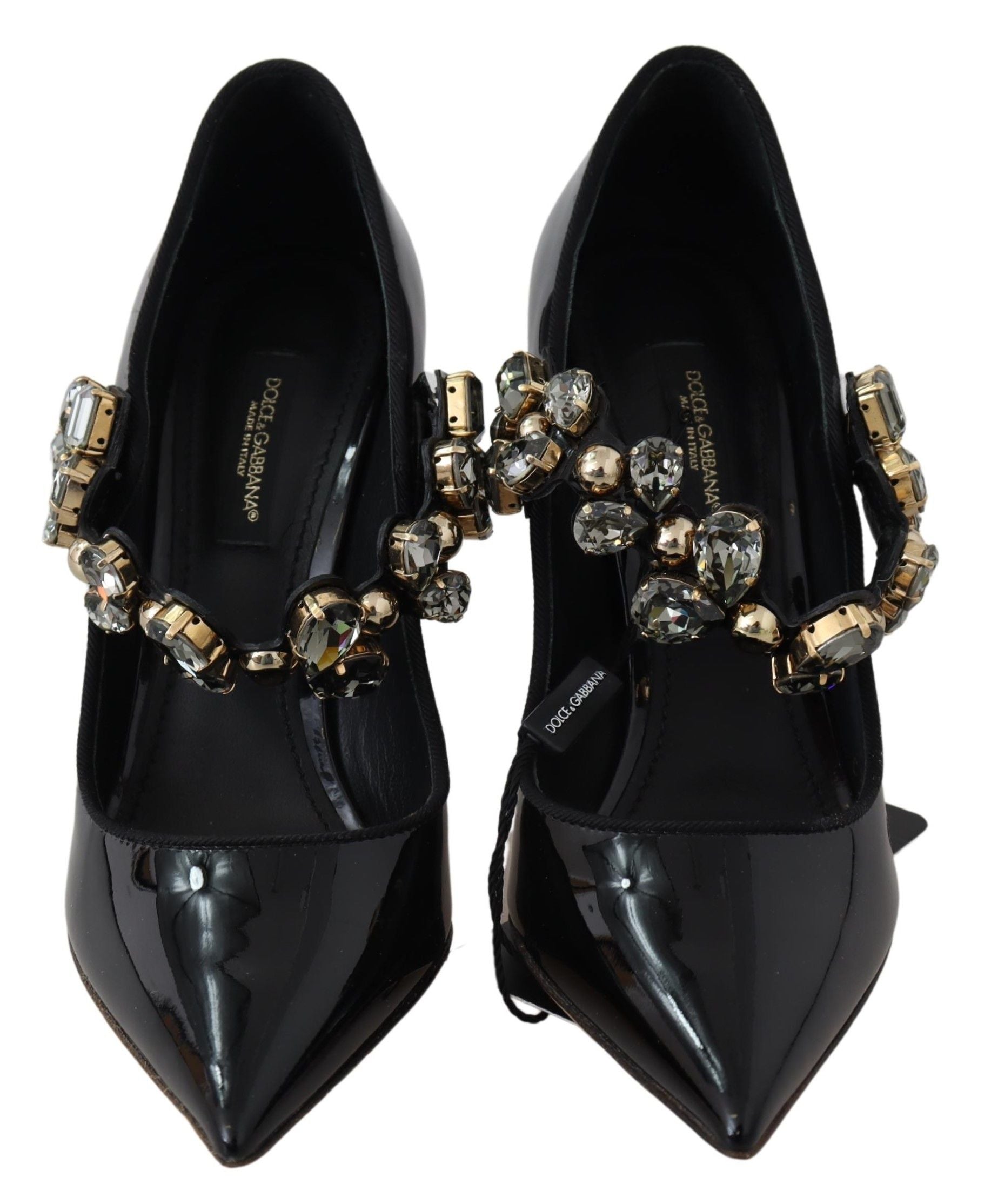 Pair of black high heel shoes with embellished straps and gold accents