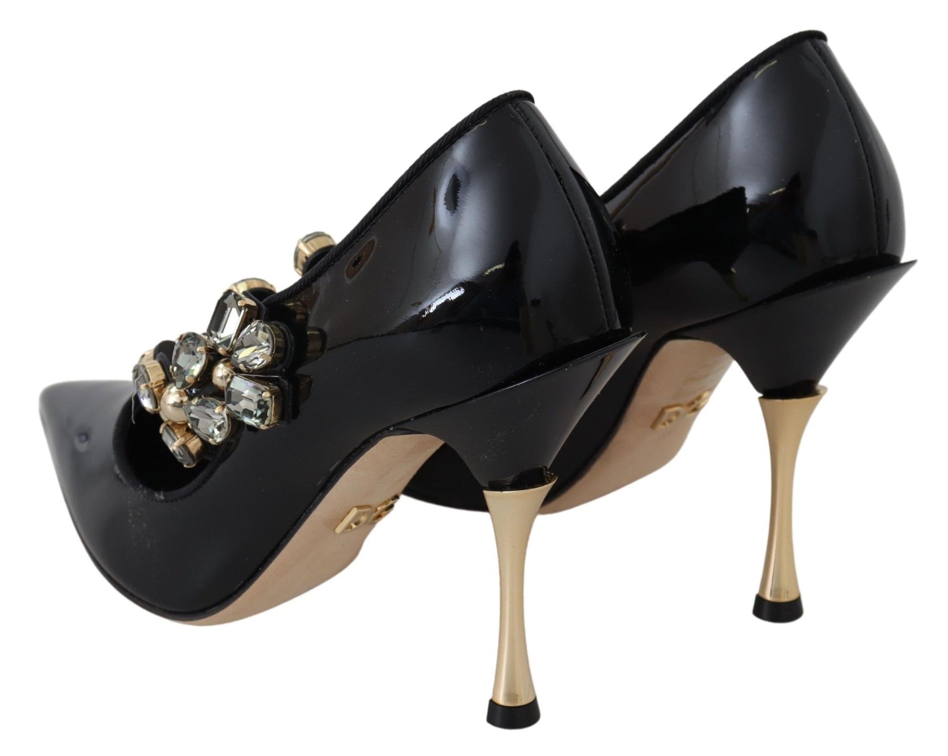 Black high heel shoes with gold accents and rhinestones on the toe