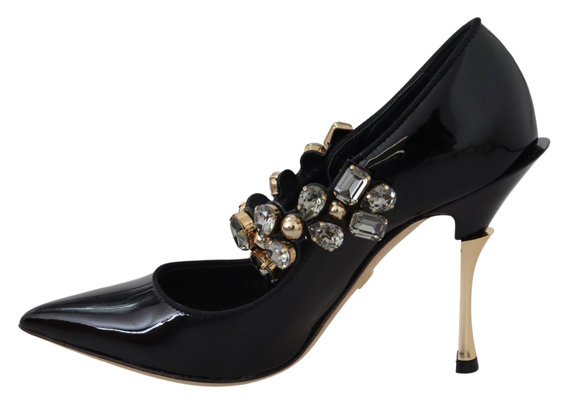 Black high heel shoe with gold accents and rhinestones on toe