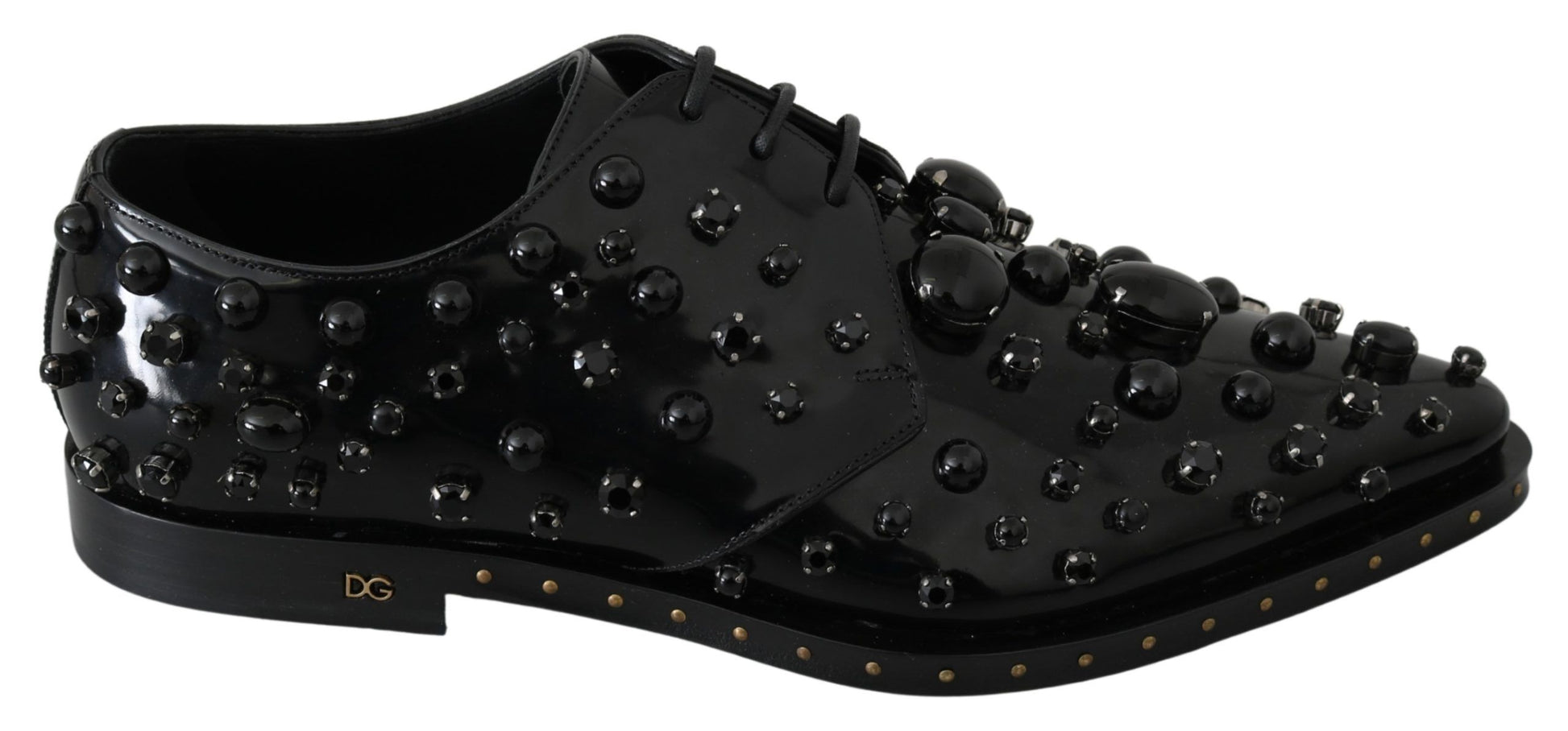 Black shoe with studs and gold accents