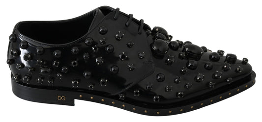 Black shoe with studs and gold accents