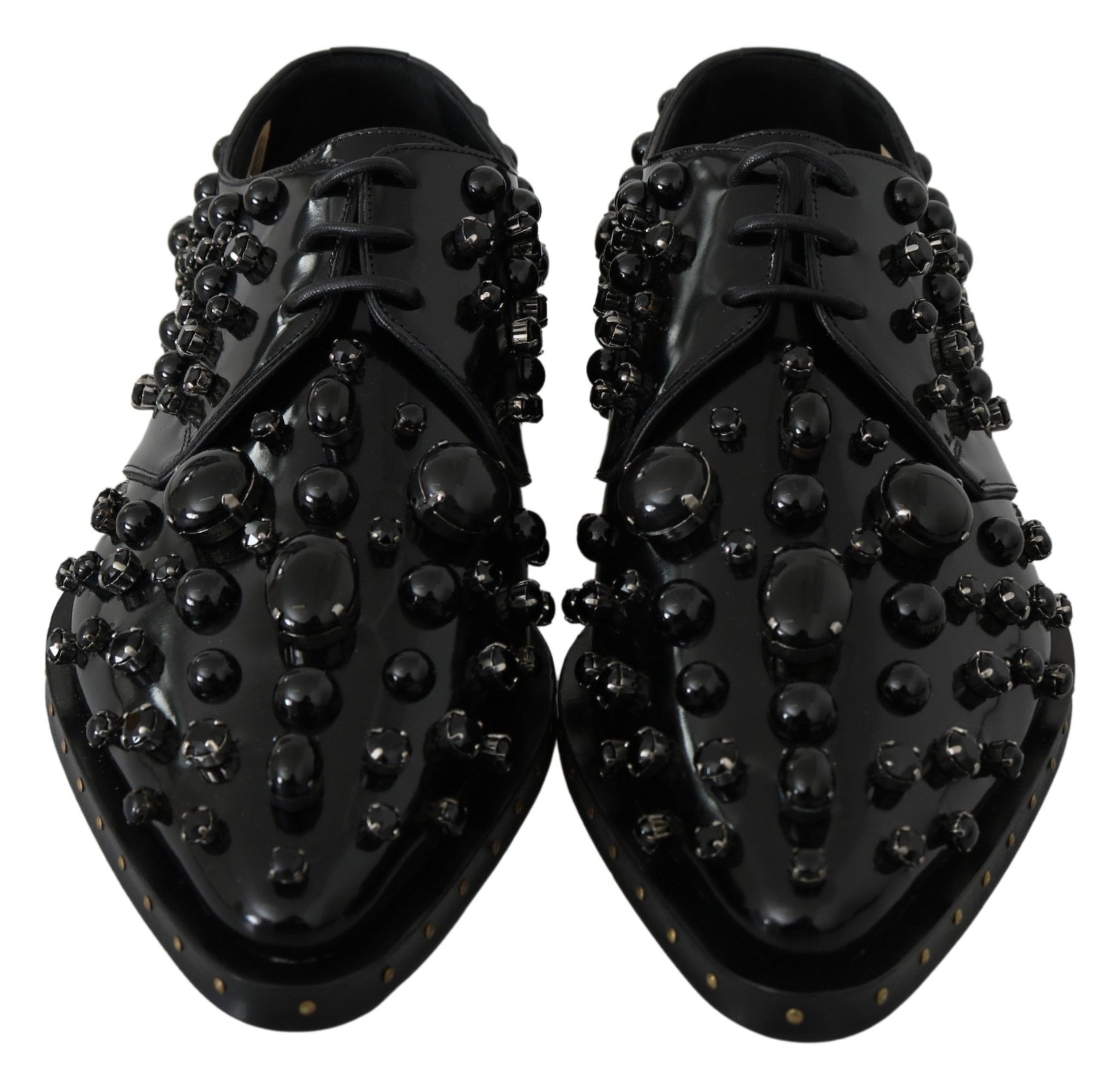 Pair of black shoes with round studs on top and sides