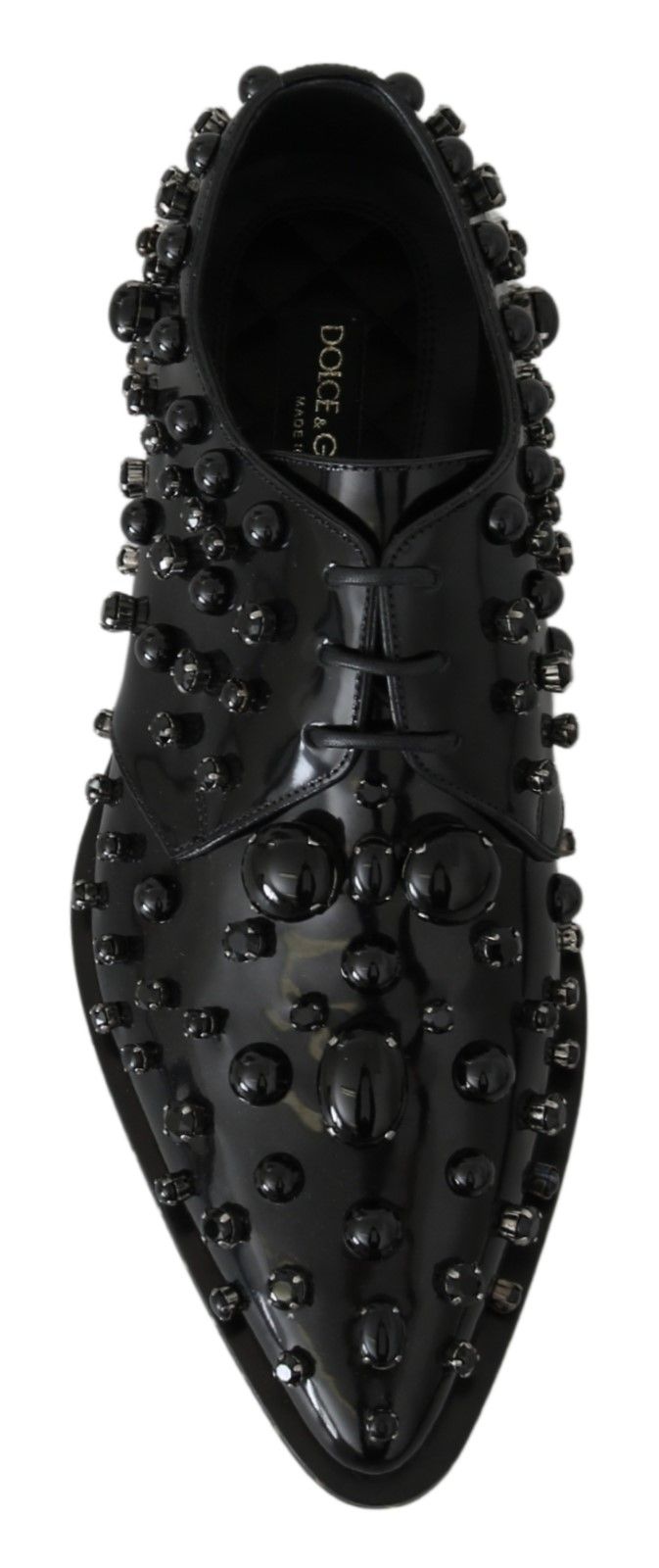 Black shoe with studs on top and bottom