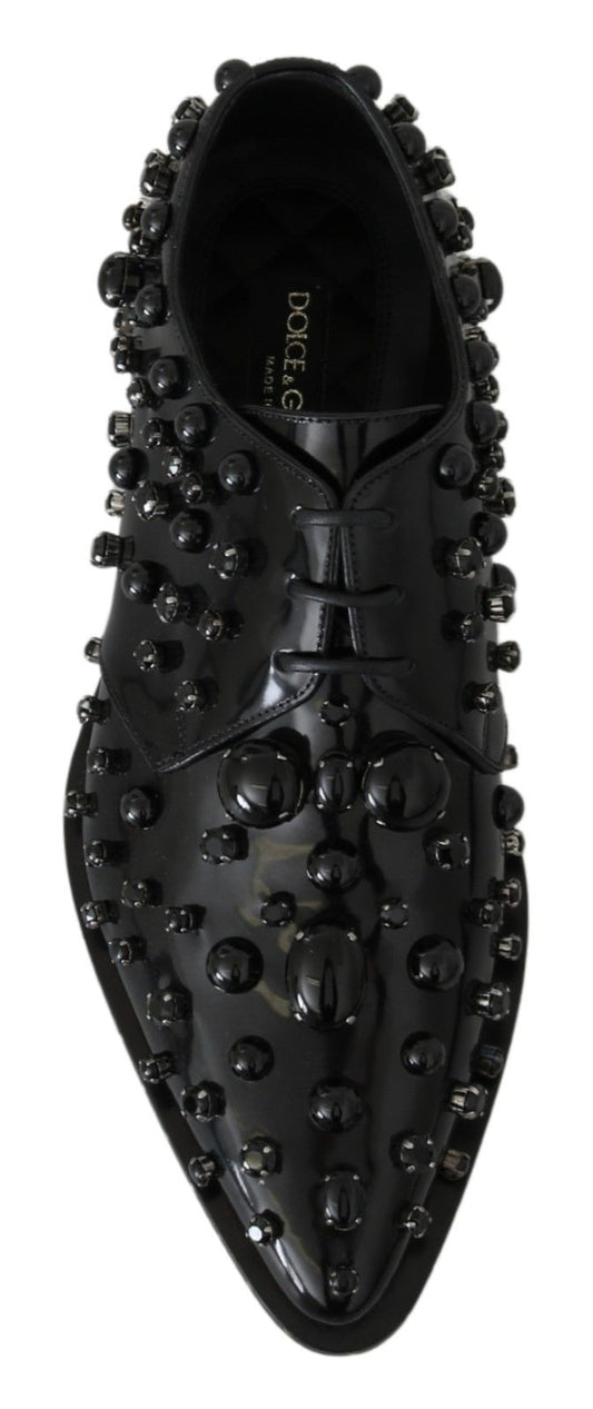 Black shoe with studs on top and bottom