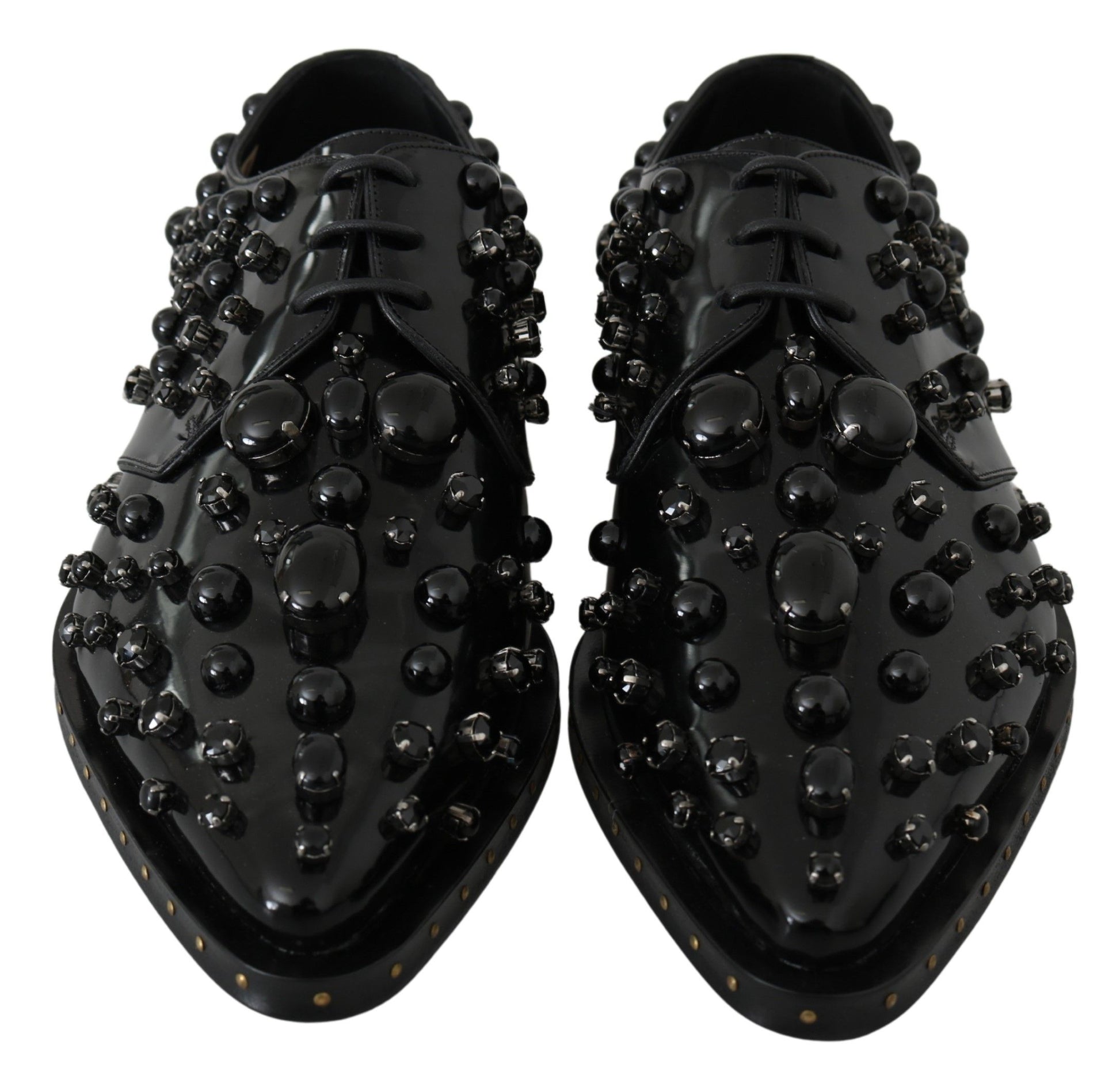 Pair of black shoes with round studs on top and sides