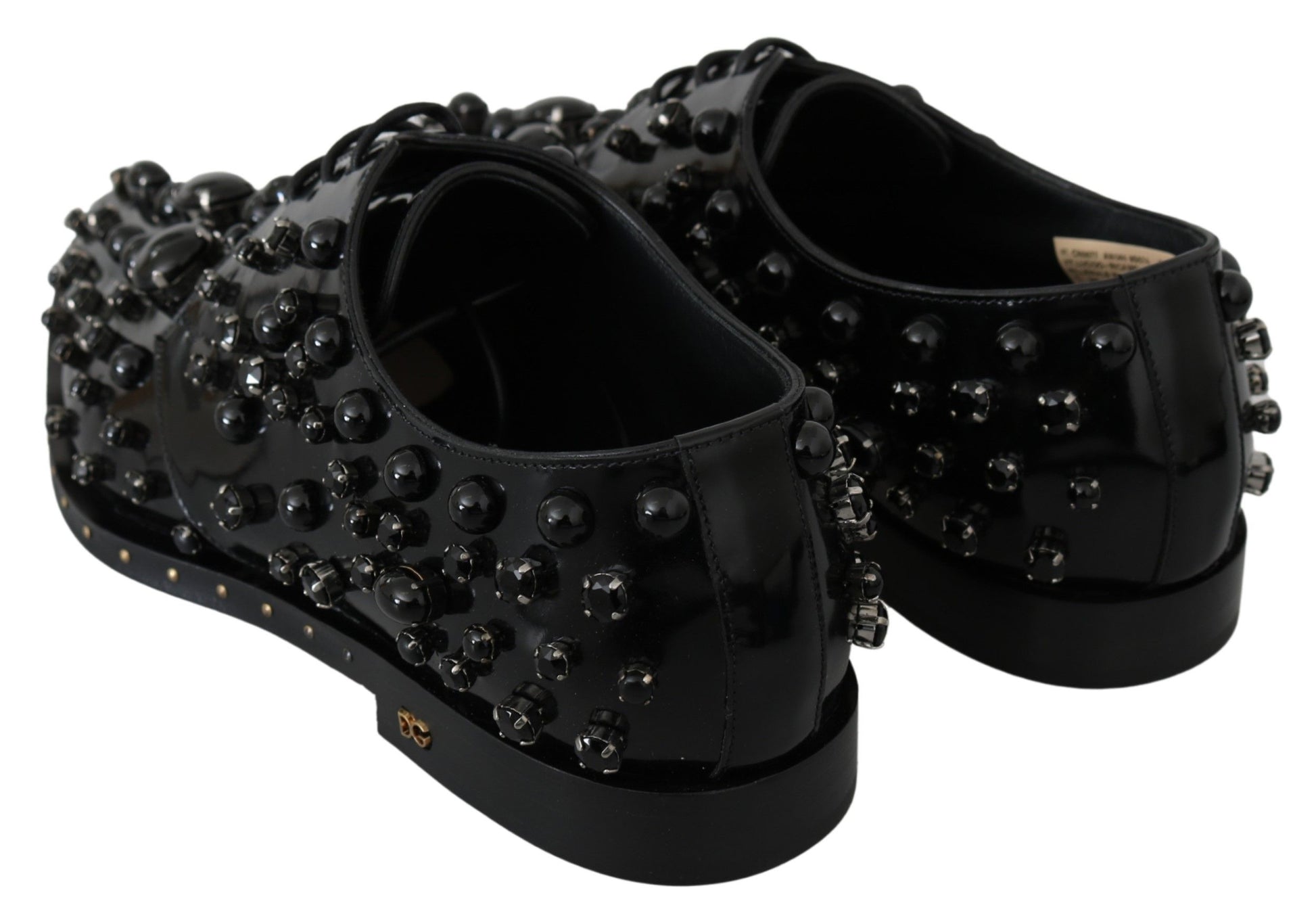 Black shoes with studs and a bow on top
