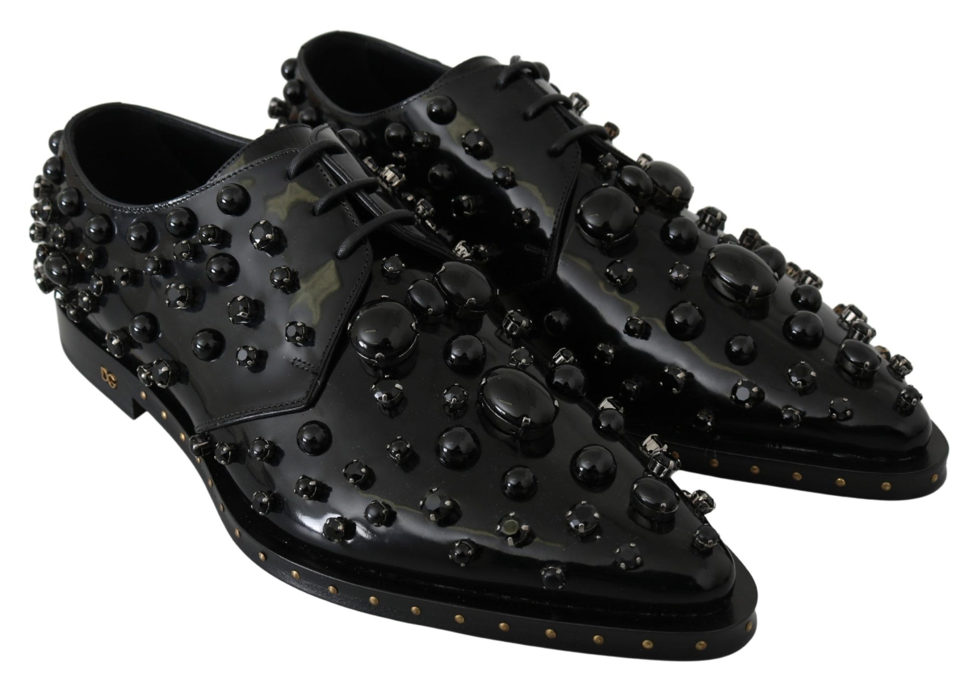 Pair of black shoes with numerous small studs on top and sides