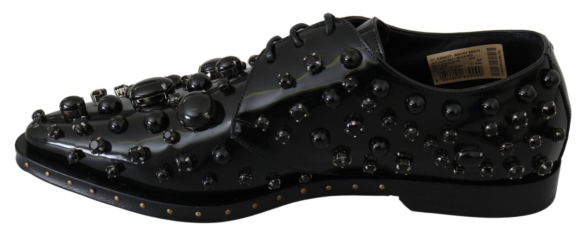 Black shoe with numerous small black balls on top and bottom