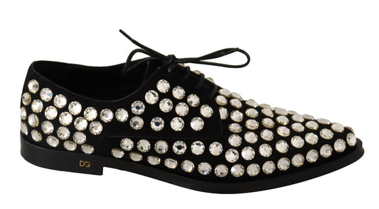 Black shoe with sparkling stones on top of toe cap and heel