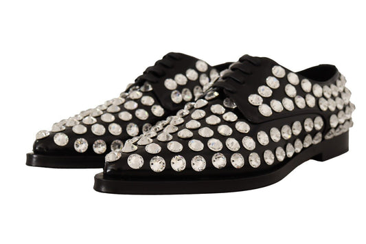 Black shoes with sparkling studs on top of soles