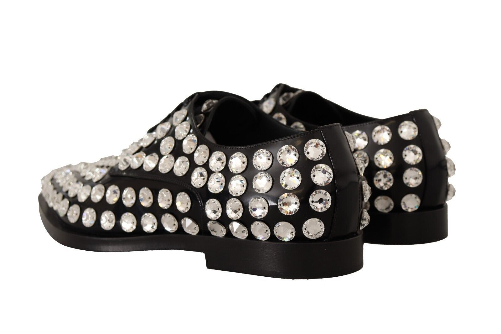 Black shoes with multiple rows of sparkling stones on top and sides