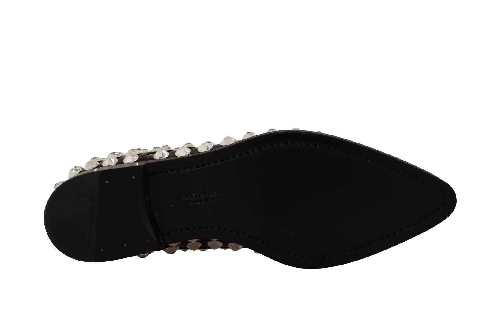 Black shoe with spikes on sole