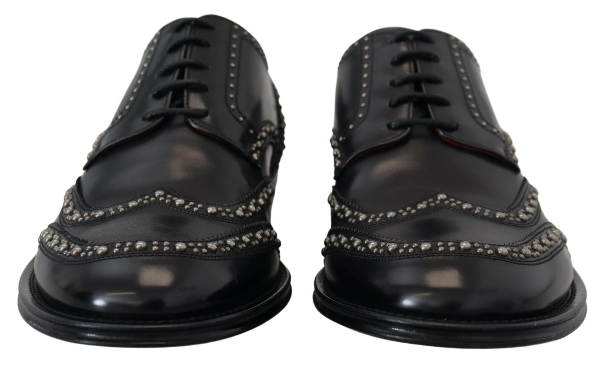 Pair of black leather derby shoes with studded detailing, featuring lace-up closure and a low heel
