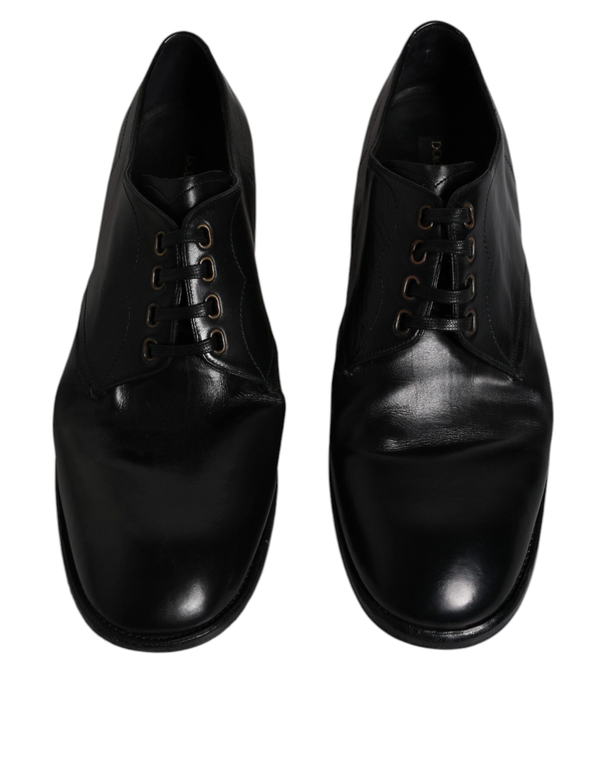 Pair of black leather dress shoes with laces and gold accents, designed by Dolce & Gabbana