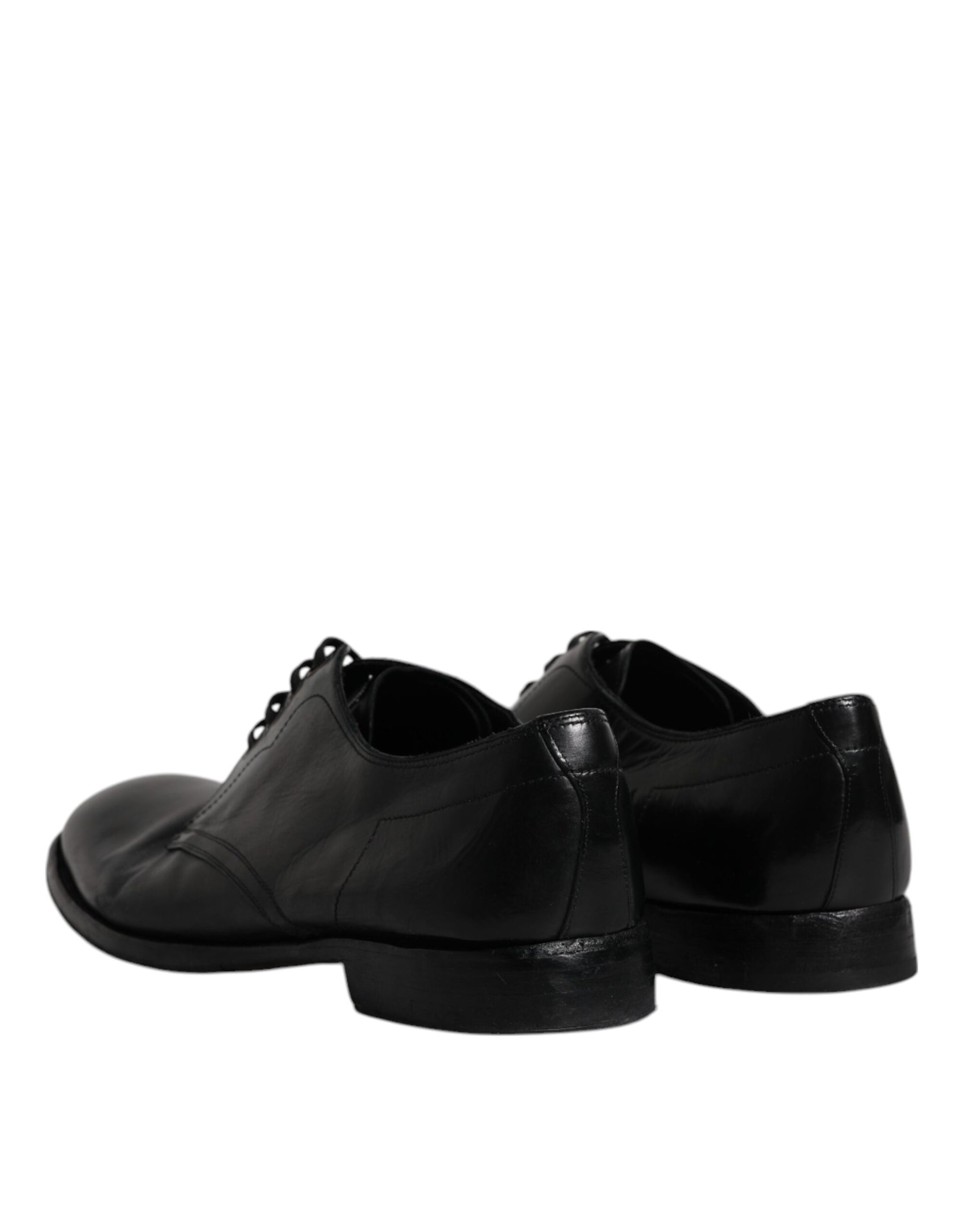 Pair of black leather dress shoes with laces and a shiny finish, designed for formal wear