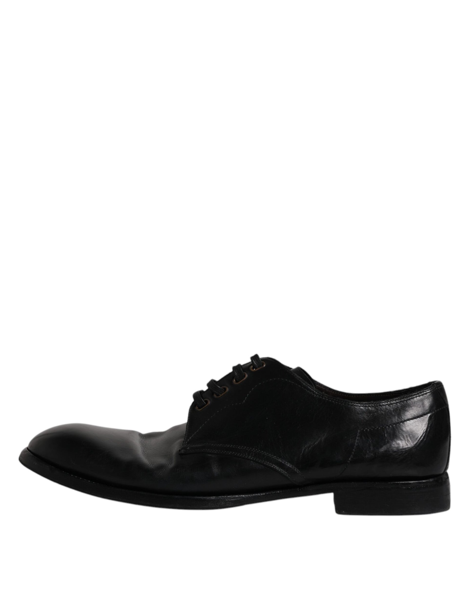 Pair of black leather dress shoes with laces, featuring a derby style and a low heel