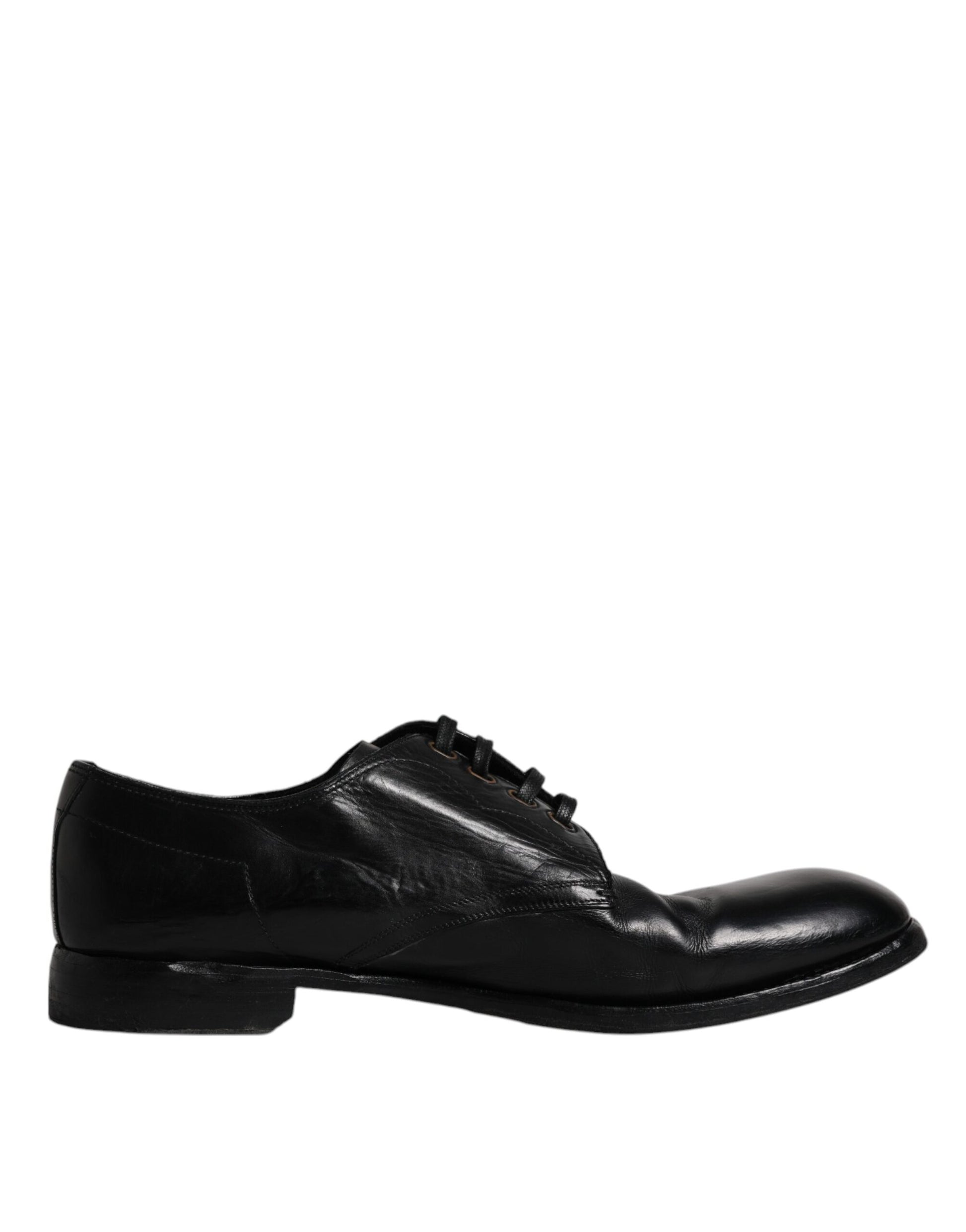 A pair of black leather dress shoes with a lace-up front, designed by Dolce & Gabbana