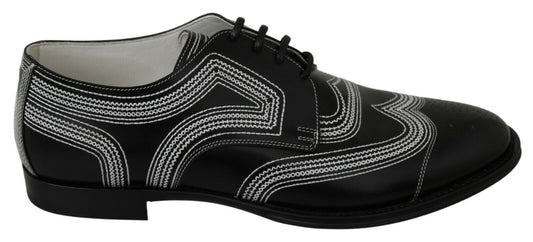 Black dress shoes with white laces and a patterned design on the side