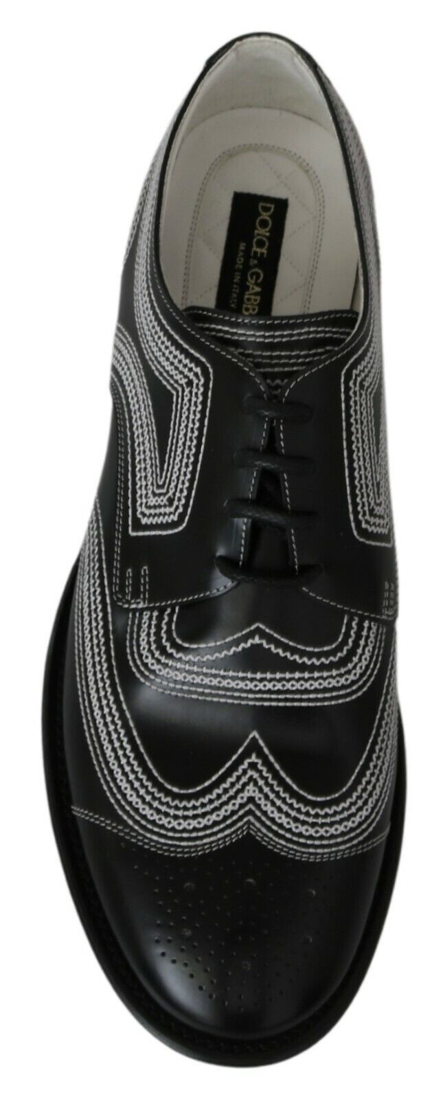 Black shoe with white laces and a patterned design on the side