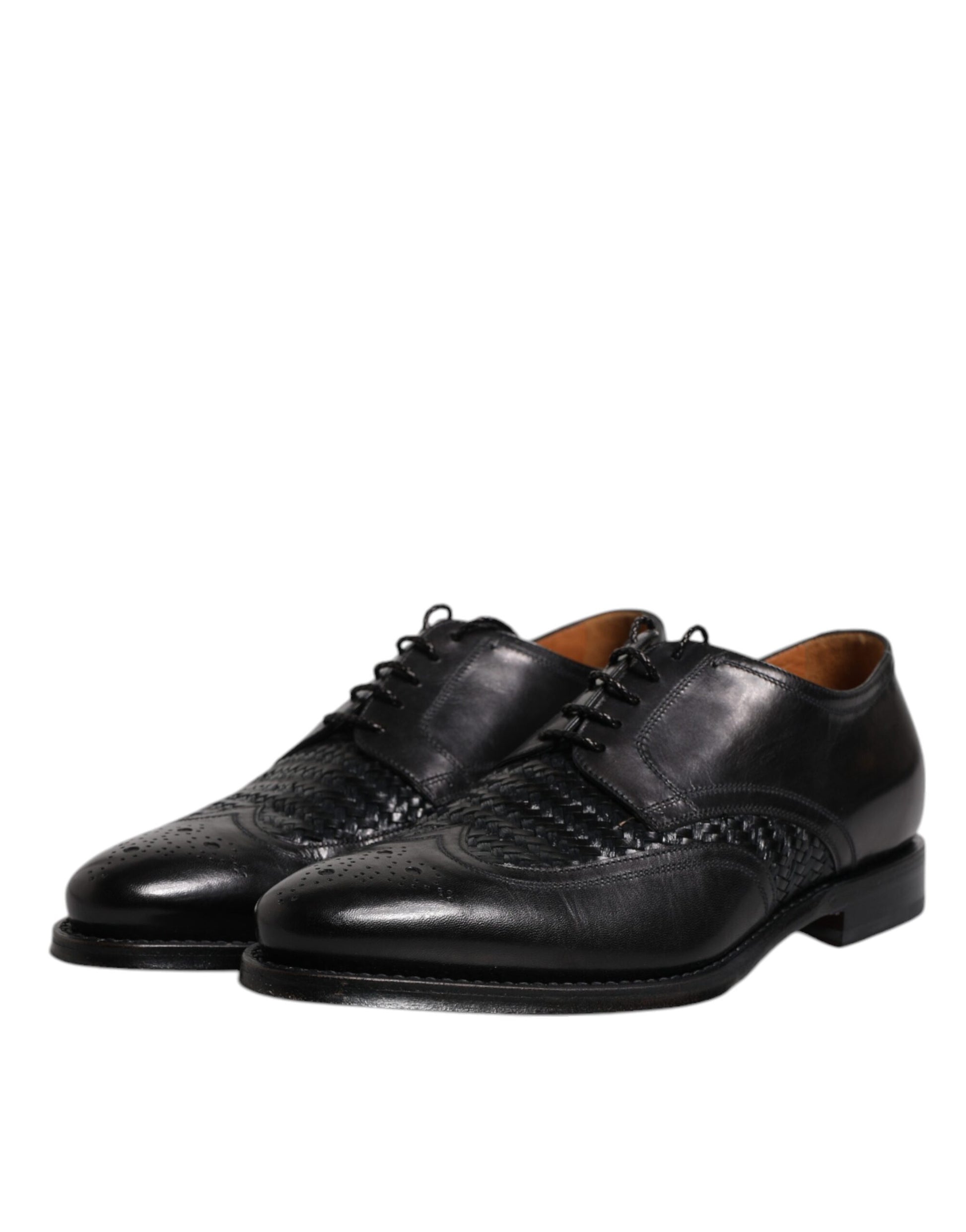 Pair of black leather dress shoes with laces, wingtip design and embossed logo