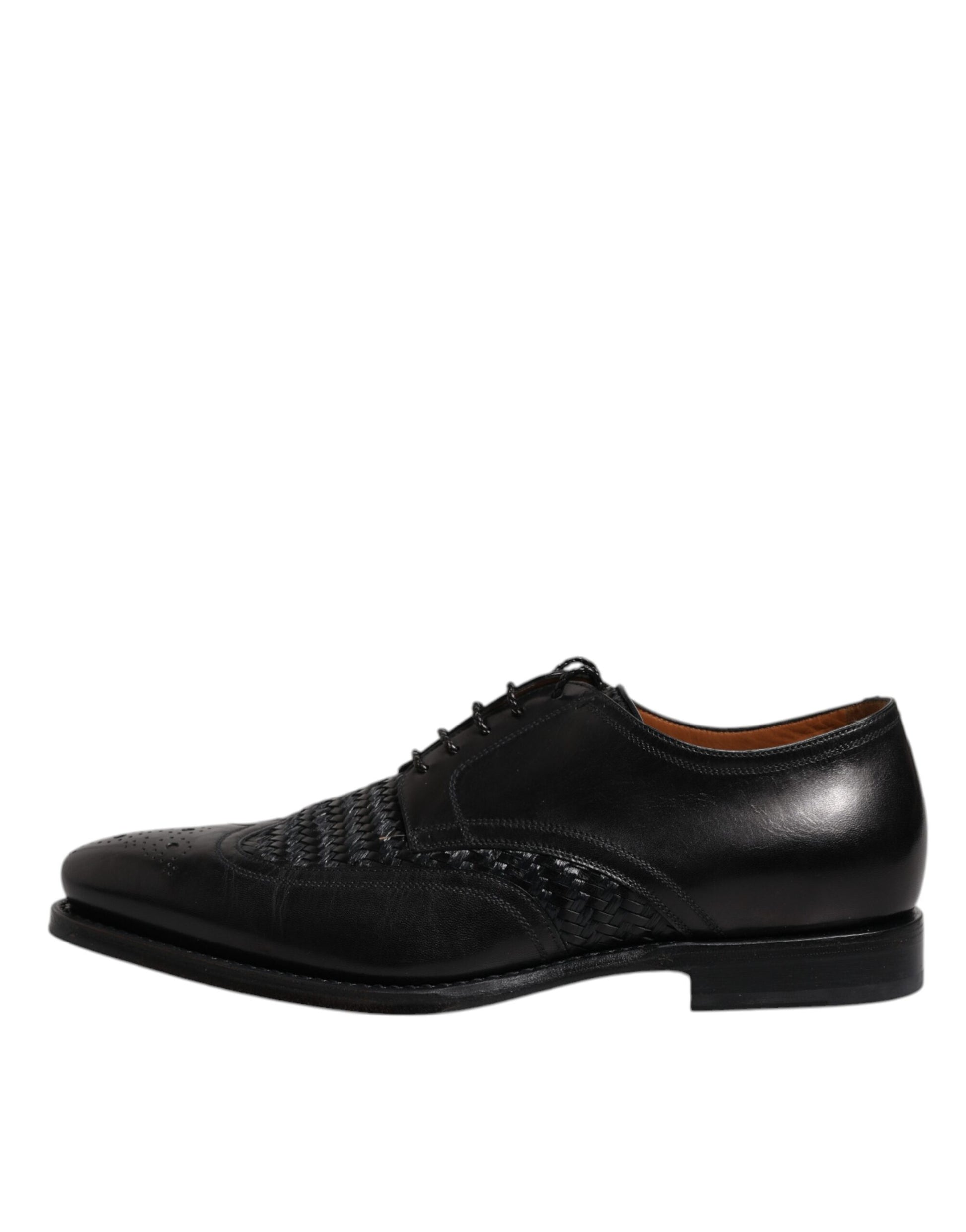 A pair of black leather dress shoes with laces, featuring a wingtip design and a textured pattern on the toe cap