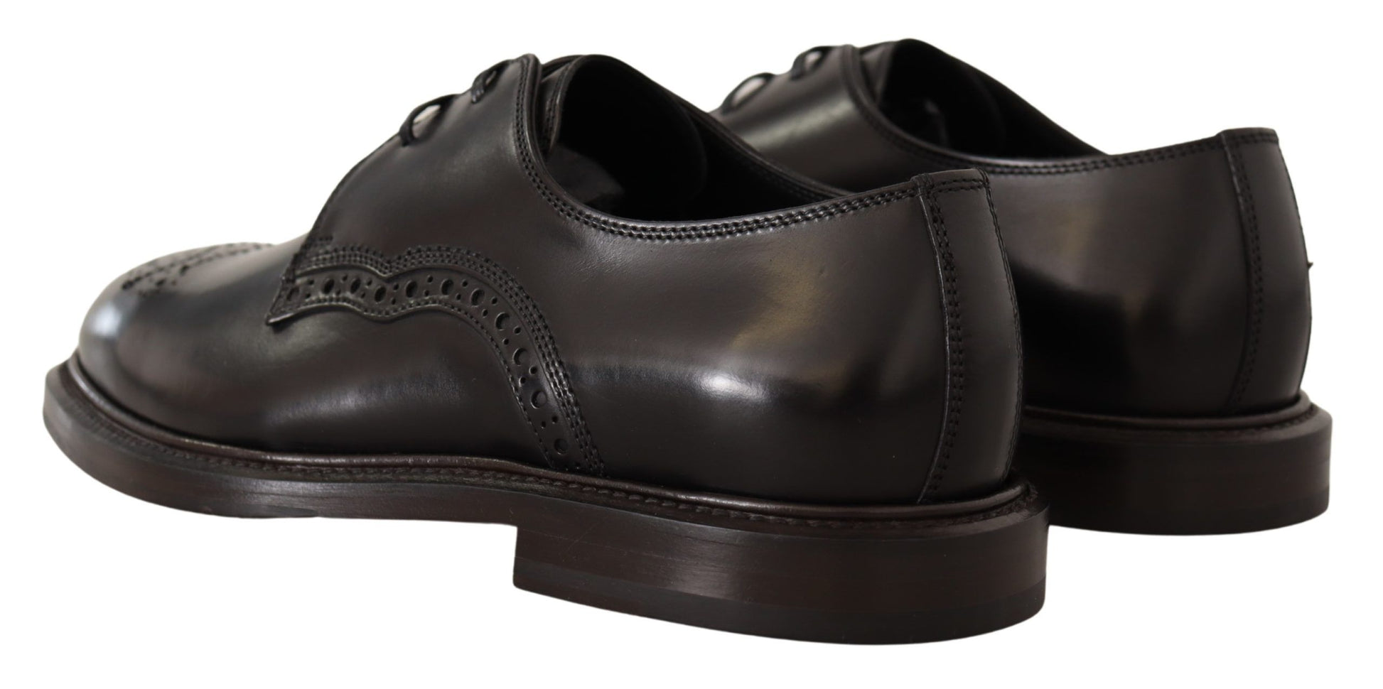 Pair of black leather shoes with laces and a small heel