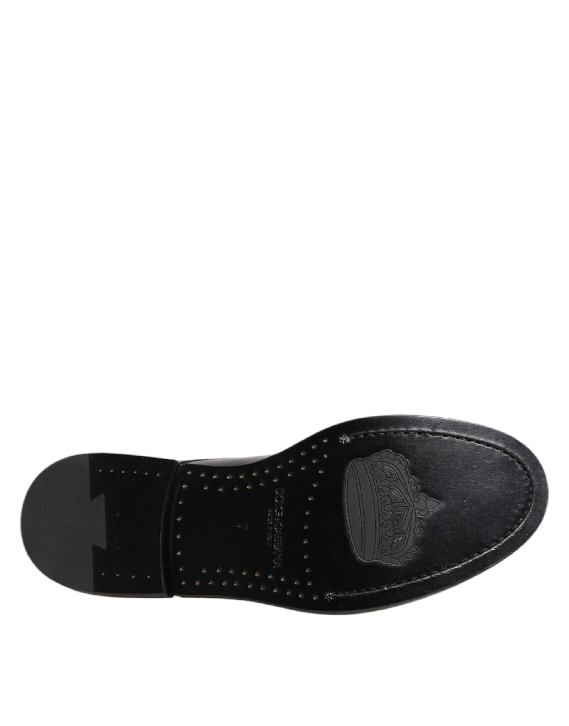 A black leather dress shoe with laces, featuring a logo on the side and a strap across the top