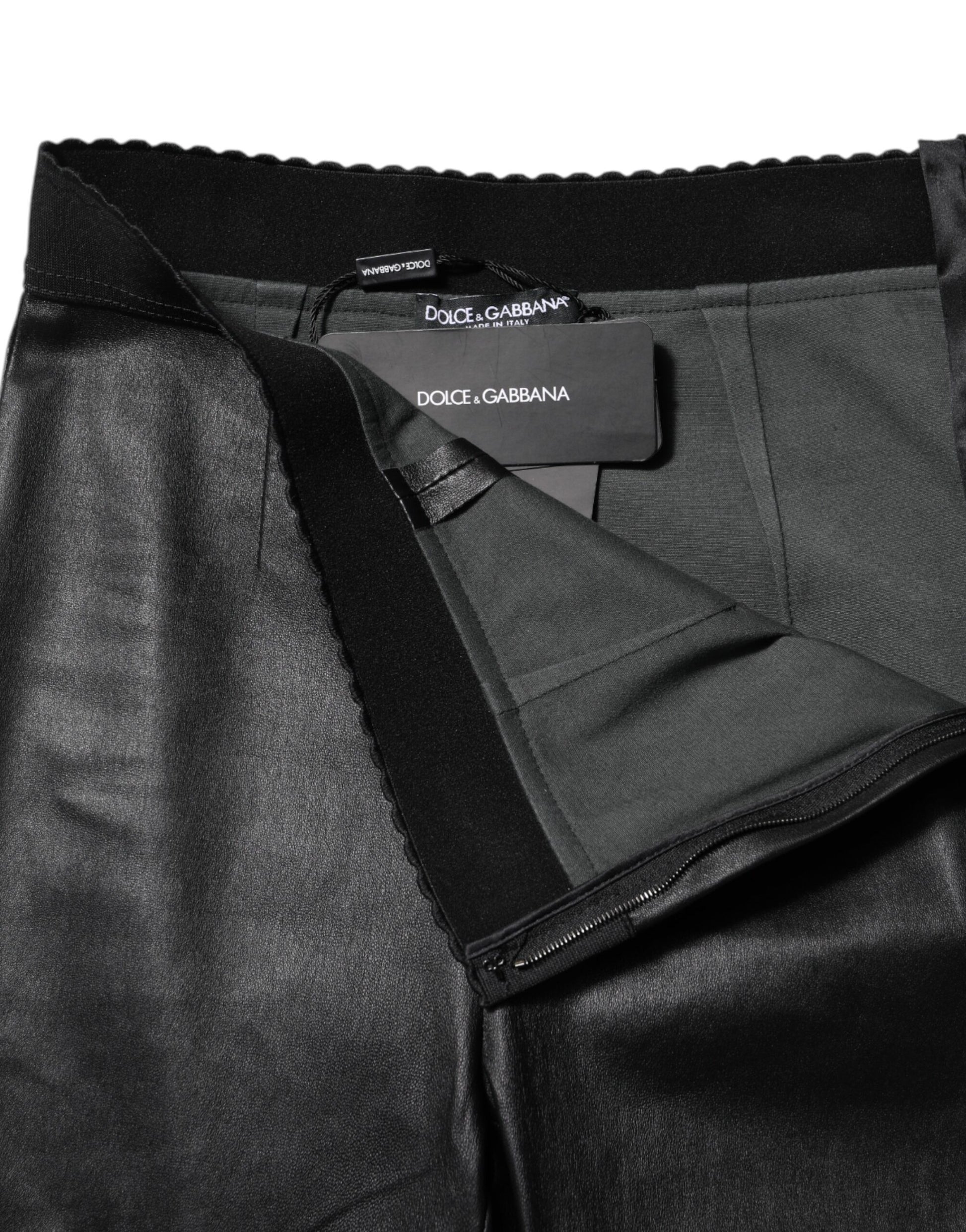 Pair of black trousers with a label on the waistband