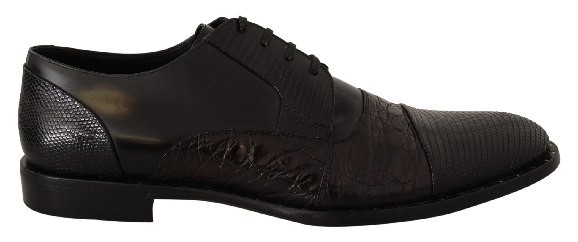 Pair of black dress shoes with a patterned design on the side