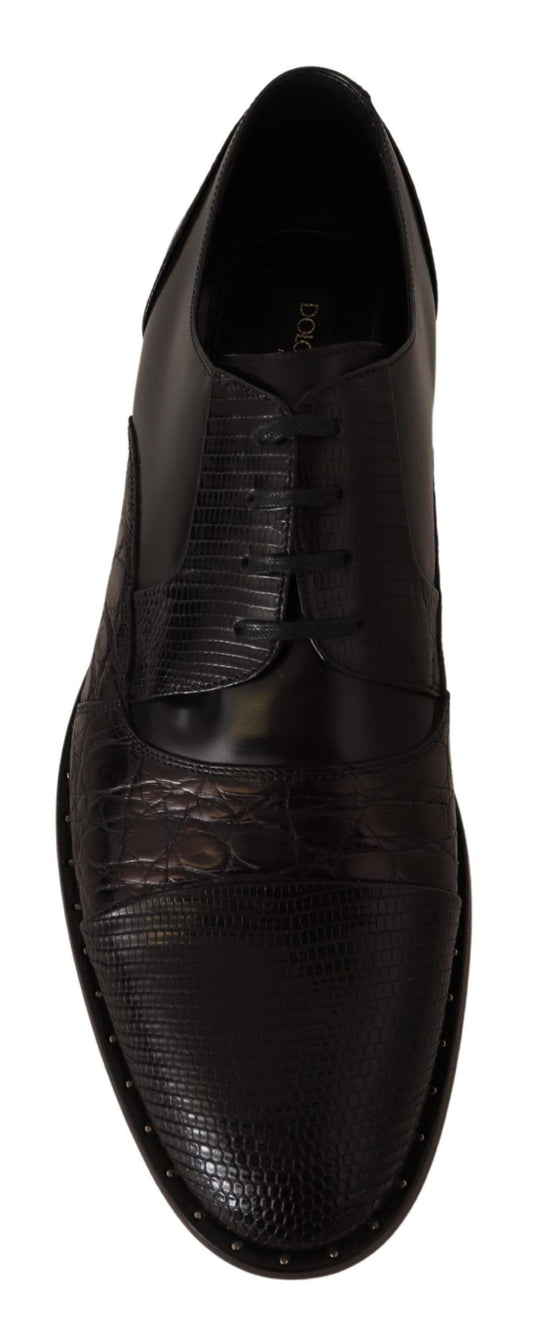 Black leather shoe with stitched detailing and a pointed toe