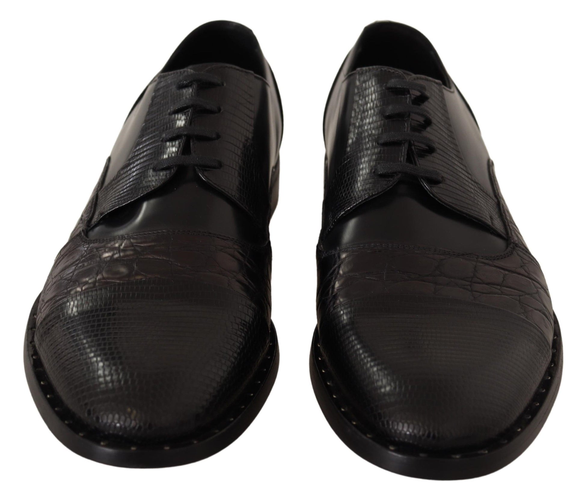 Pair of black leather shoes with laces and a crocodile skin texture on the upper part