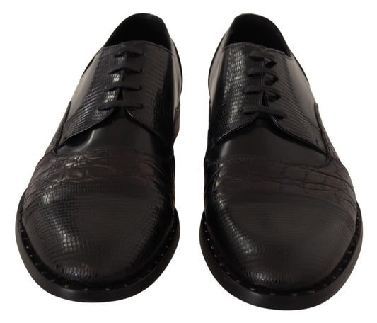 Pair of black leather shoes with laces and a crocodile skin texture on the upper part