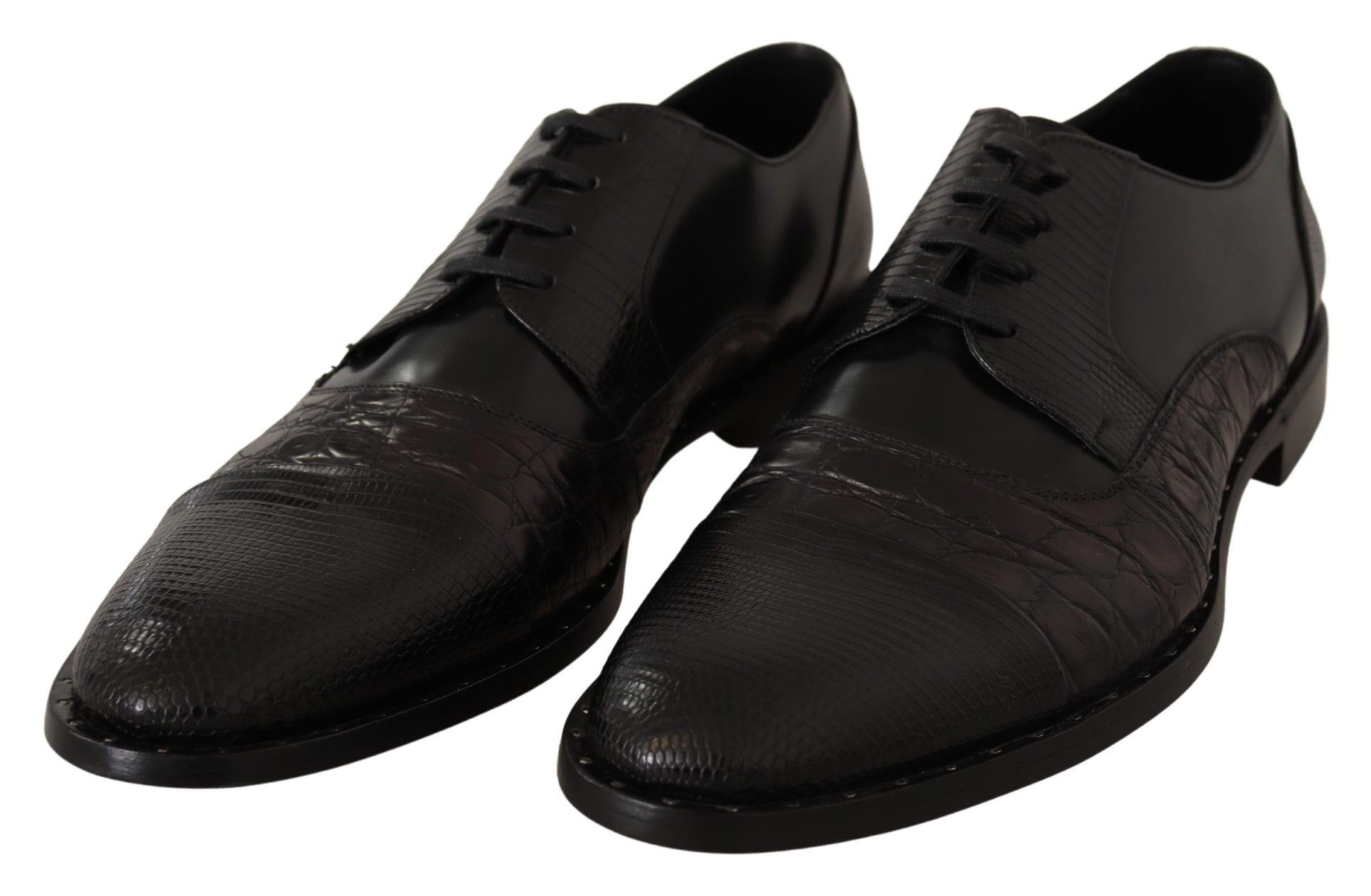 Pair of black dress shoes with laces and a patterned design on the vamp