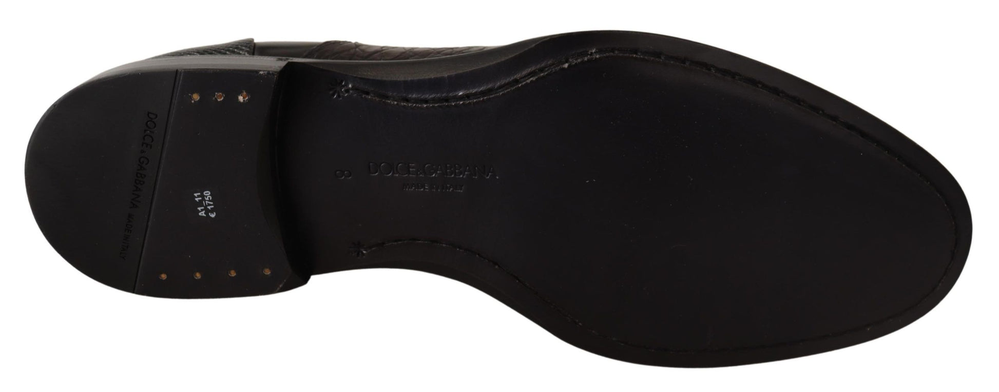 Pair of black dress shoes with laces and a small heel
