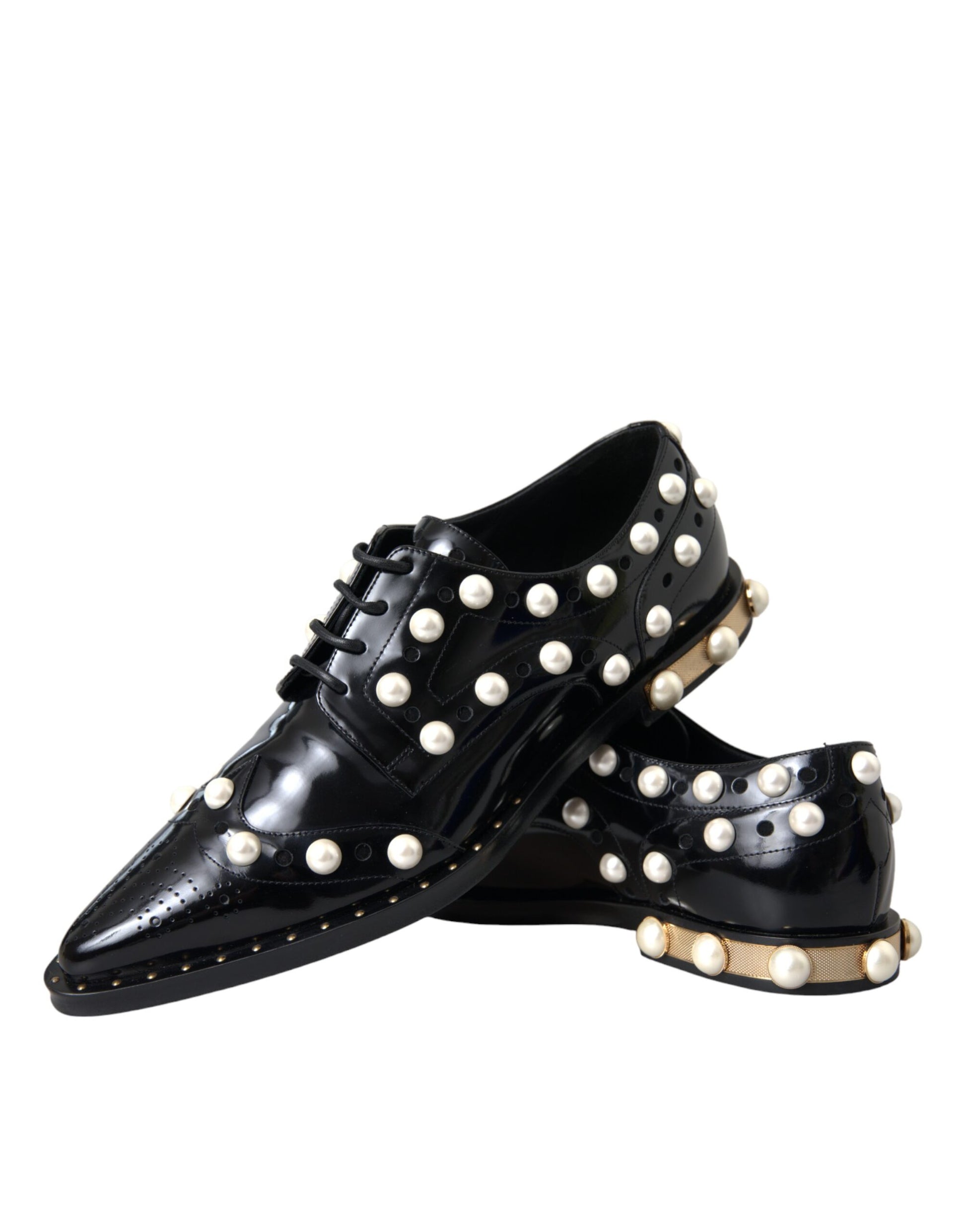 Pair of black leather shoes with faux pearls and gold accents