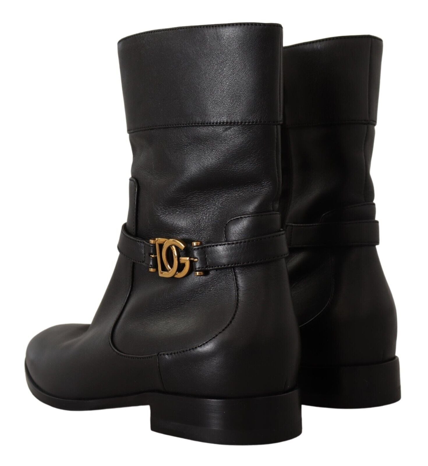 Pair of black leather boots with gold buckle and logo on side