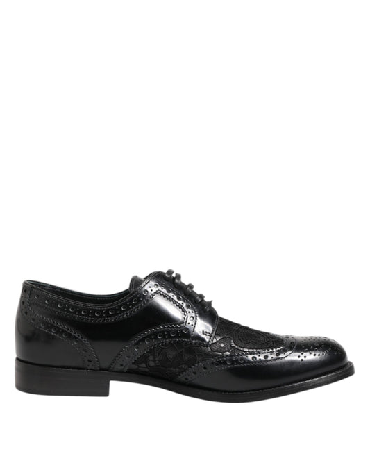 Black leather dress shoes with floral lace design and silver buckle