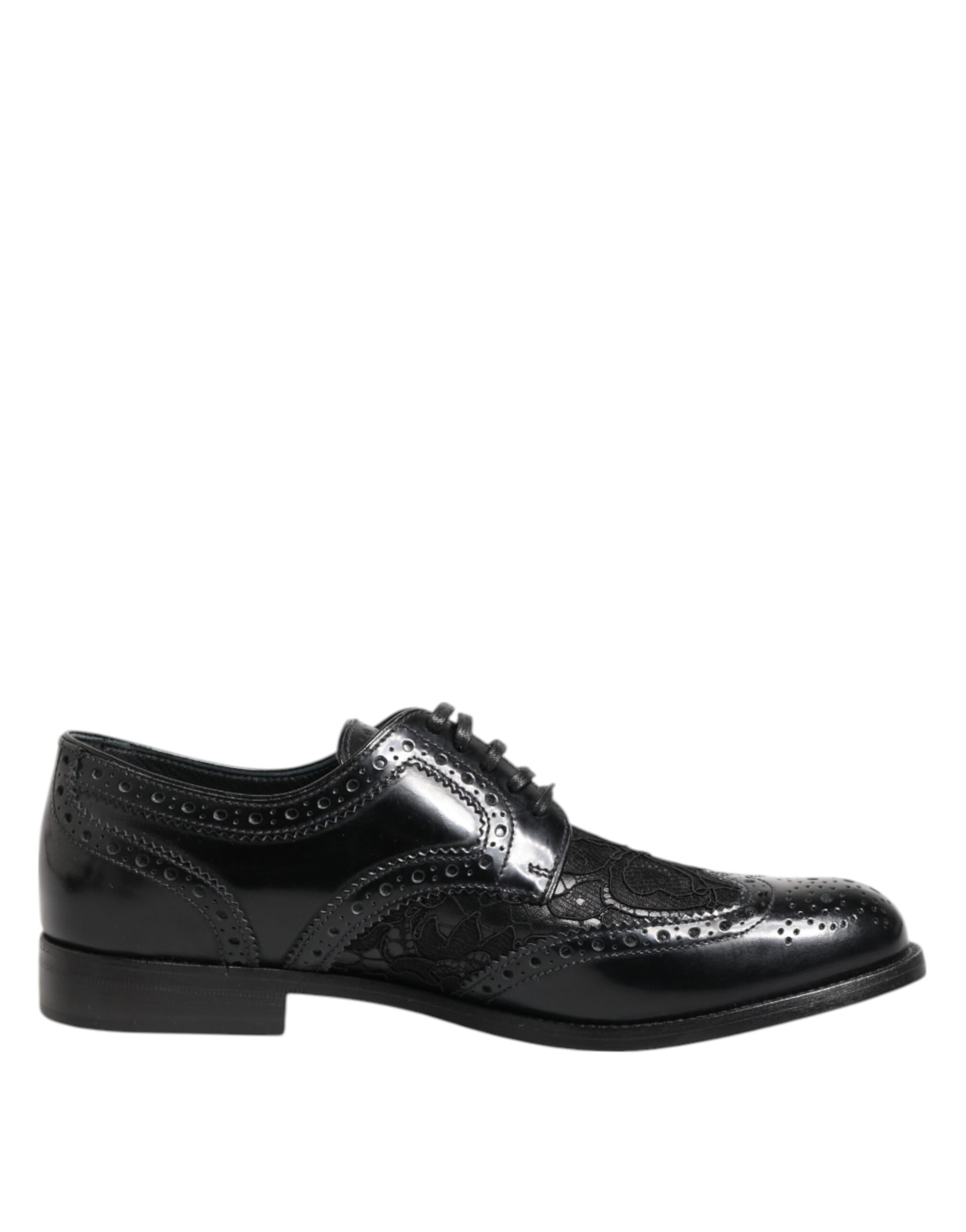 A pair of black leather shoes with floral lace detailing, designed for formal wear