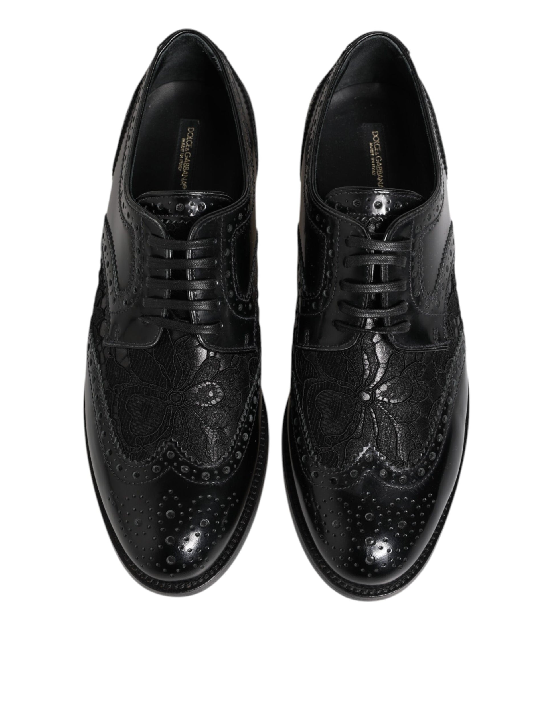 Pair of black leather shoes with floral lace and embroidered detailing