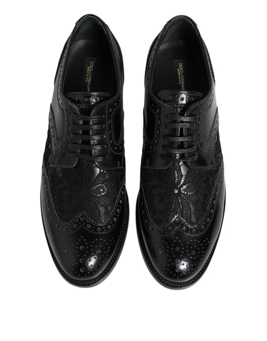 Pair of black leather shoes with floral lace and embroidered detailing