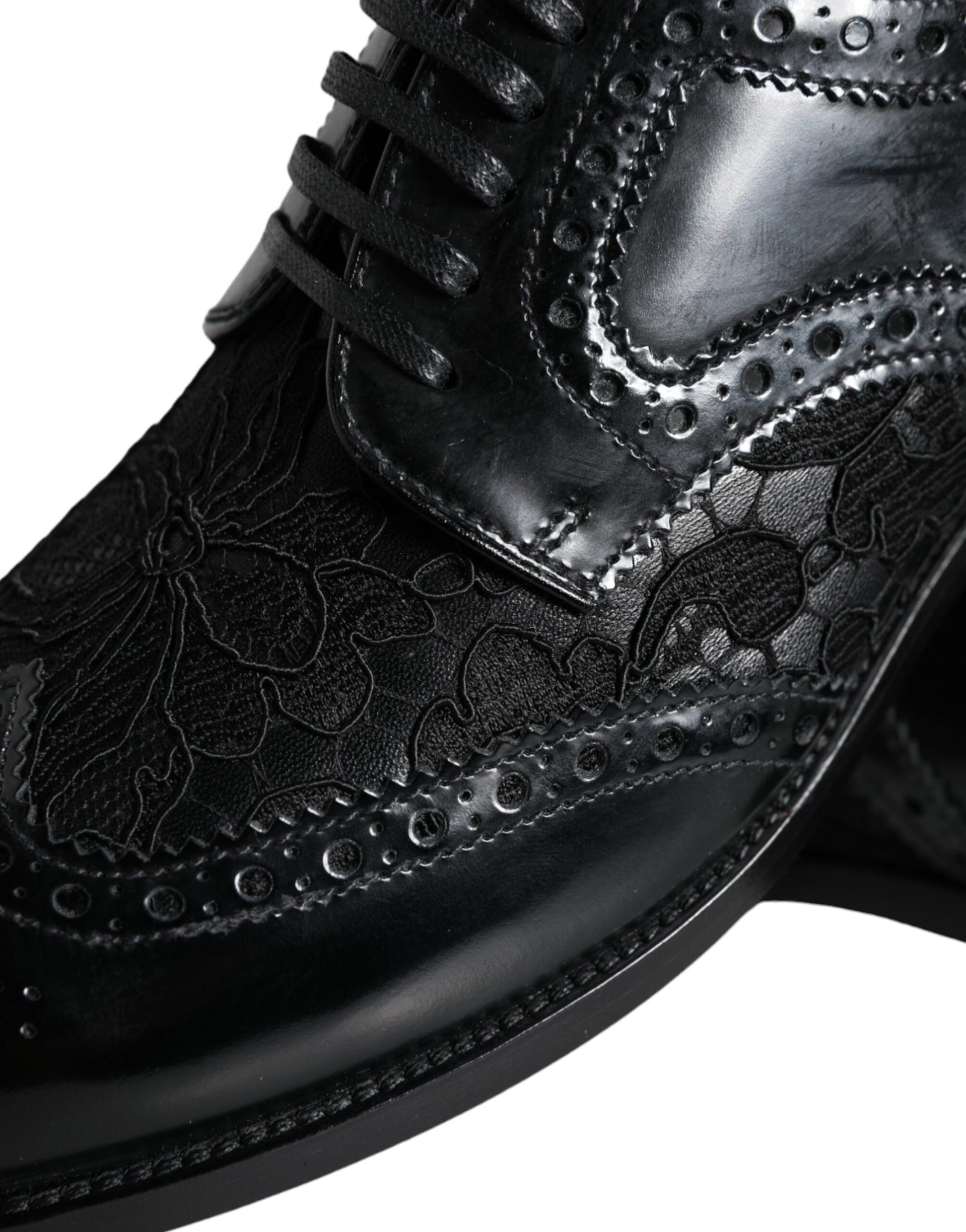 Black leather lace-up dress shoes with floral embroidery and metal studs