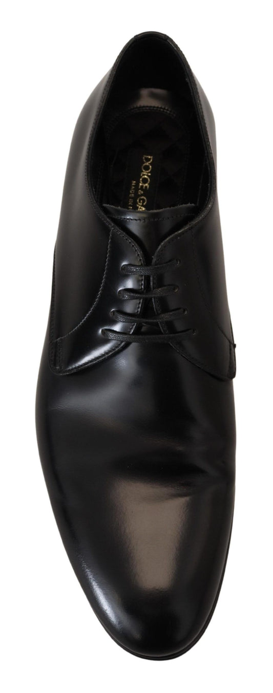 Black leather dress shoe with laces and a small heel
